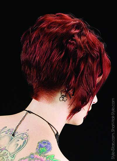model with a diagonal haircut back view with beautiful tatoo