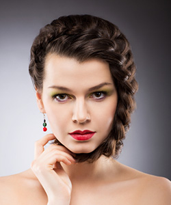 Model with braided hair on front section and bangs area
