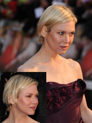 Renee Zellweger sporting short hair with bangs behind ear