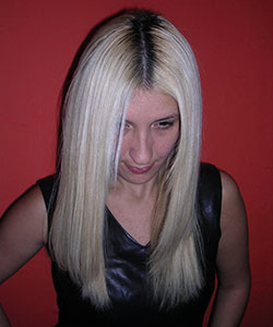 model with long blonde hair showing her grown out hair
