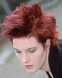 short hair model with spiky texture and violet red hair color