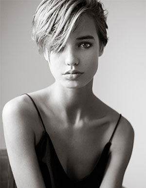 model with short hair and  wavy side bangs