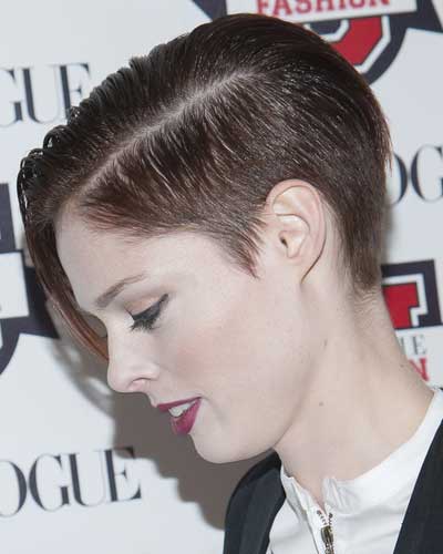 coco rocha with short hair cut on sides and tapered back