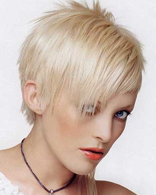 asymmetric razor hair cut in platinum blond 