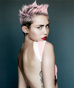 Miley with punky short hair and faded pink dip dye color