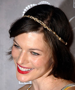 Milla Jovovich with golden metal chain headband