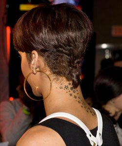 Rihanna with partial bowl haircut back view