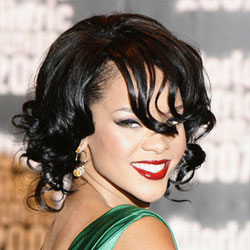 Rihanna curly hairstyle bold red lips