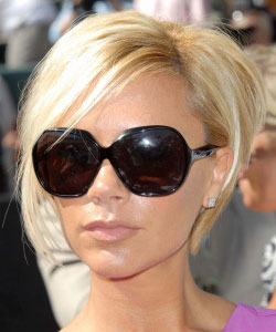 Victoria Beckham with chin-length bob in blonde wearing sun glasses