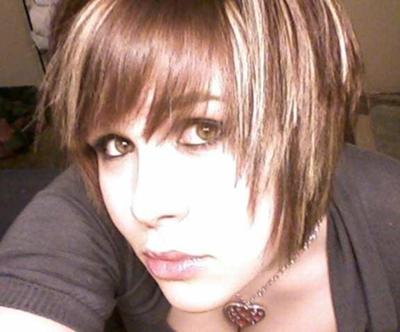 Great emo haircut with blonde streaks in dark brown hair